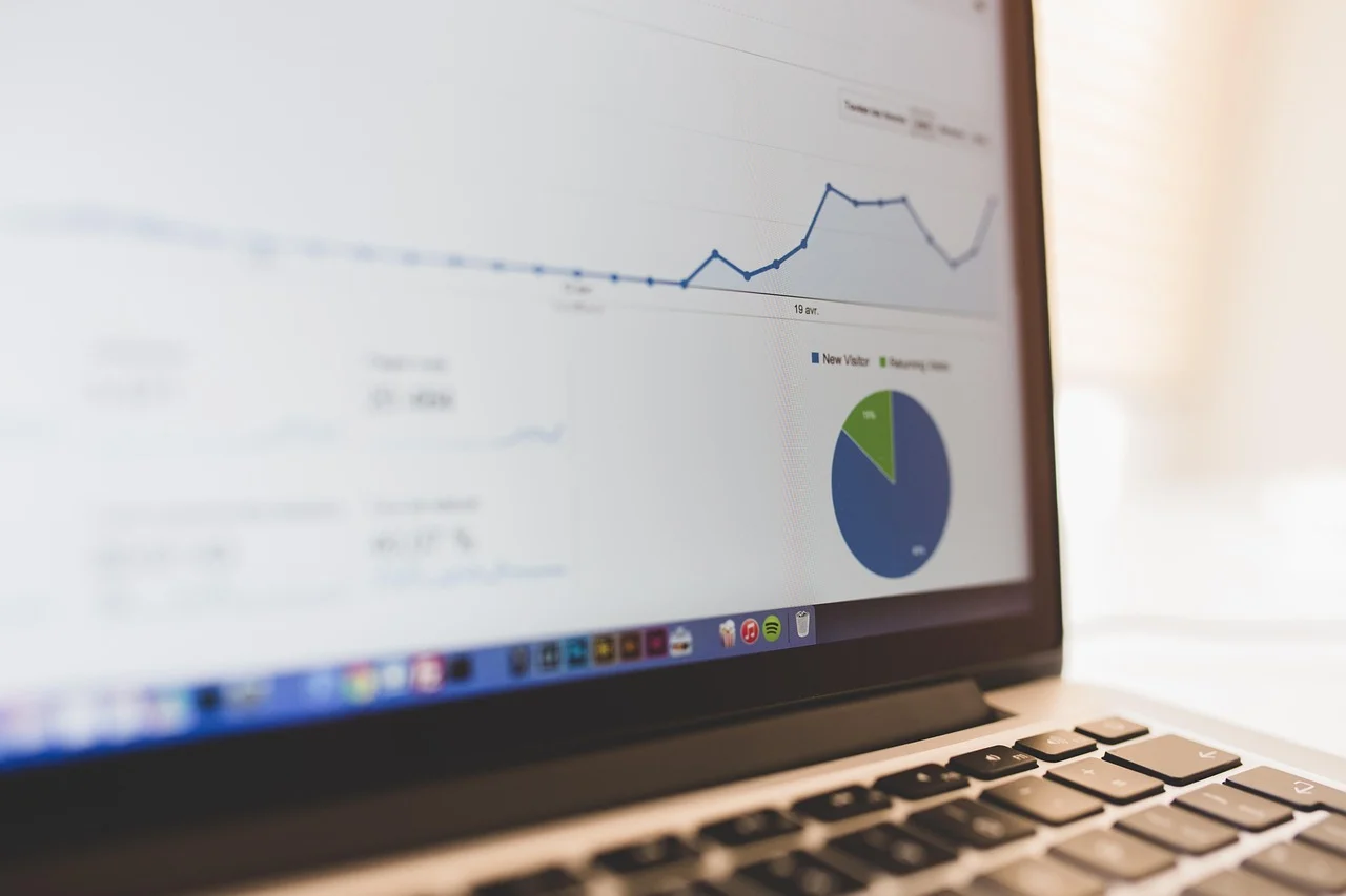 CRM dashboard on a monitor showing sales metrics and AI insights