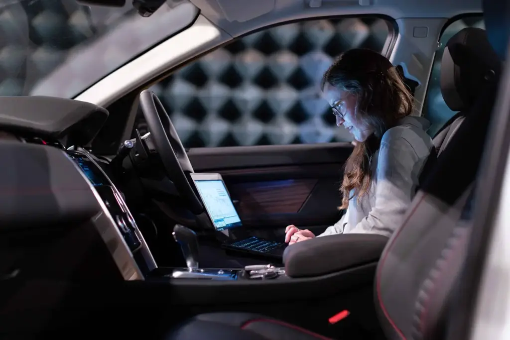 Person testing AI automation software on a laptop with trial version